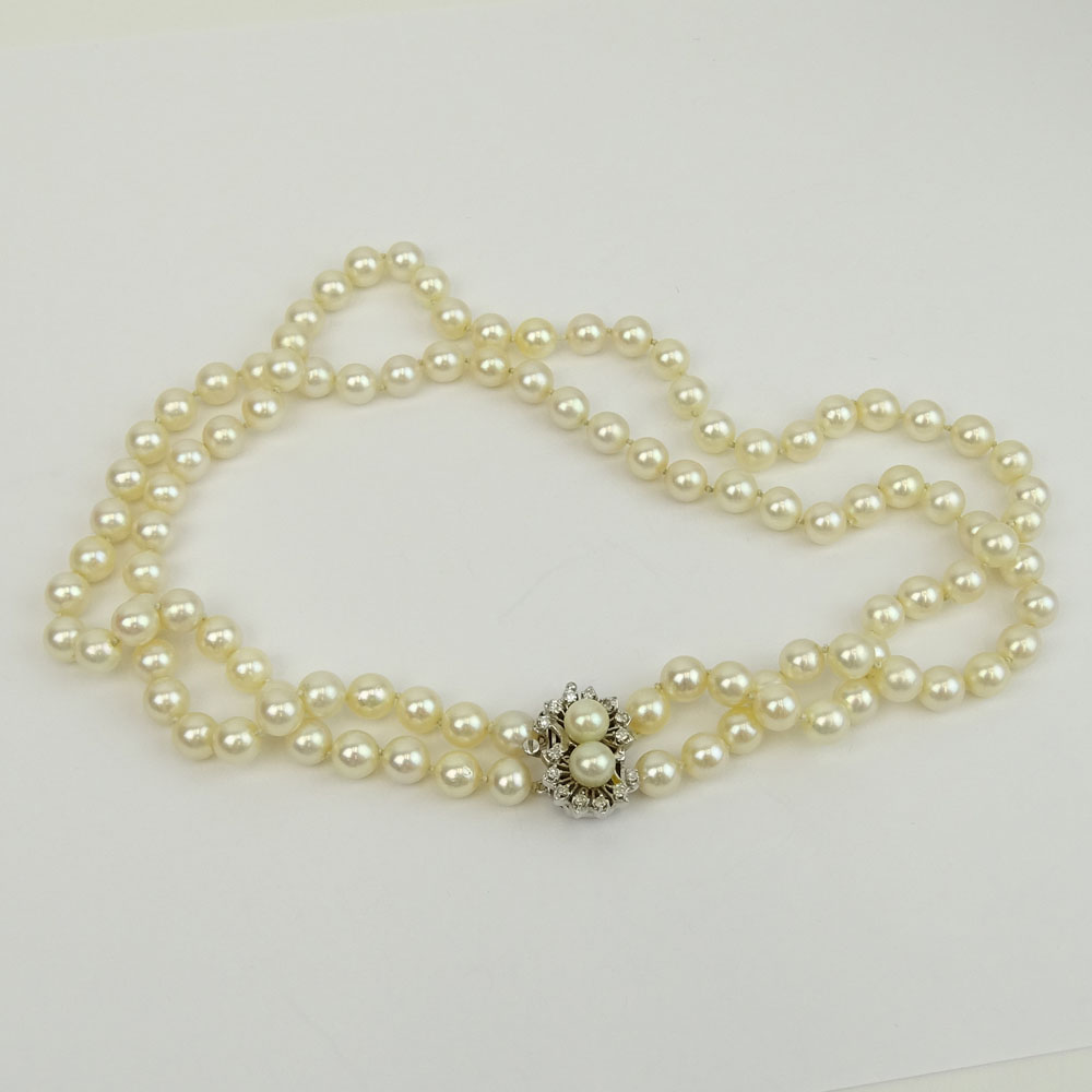 Vintage Double Strand White Pearl Necklace with 14 Karat White Gold and Diamond Clasp.