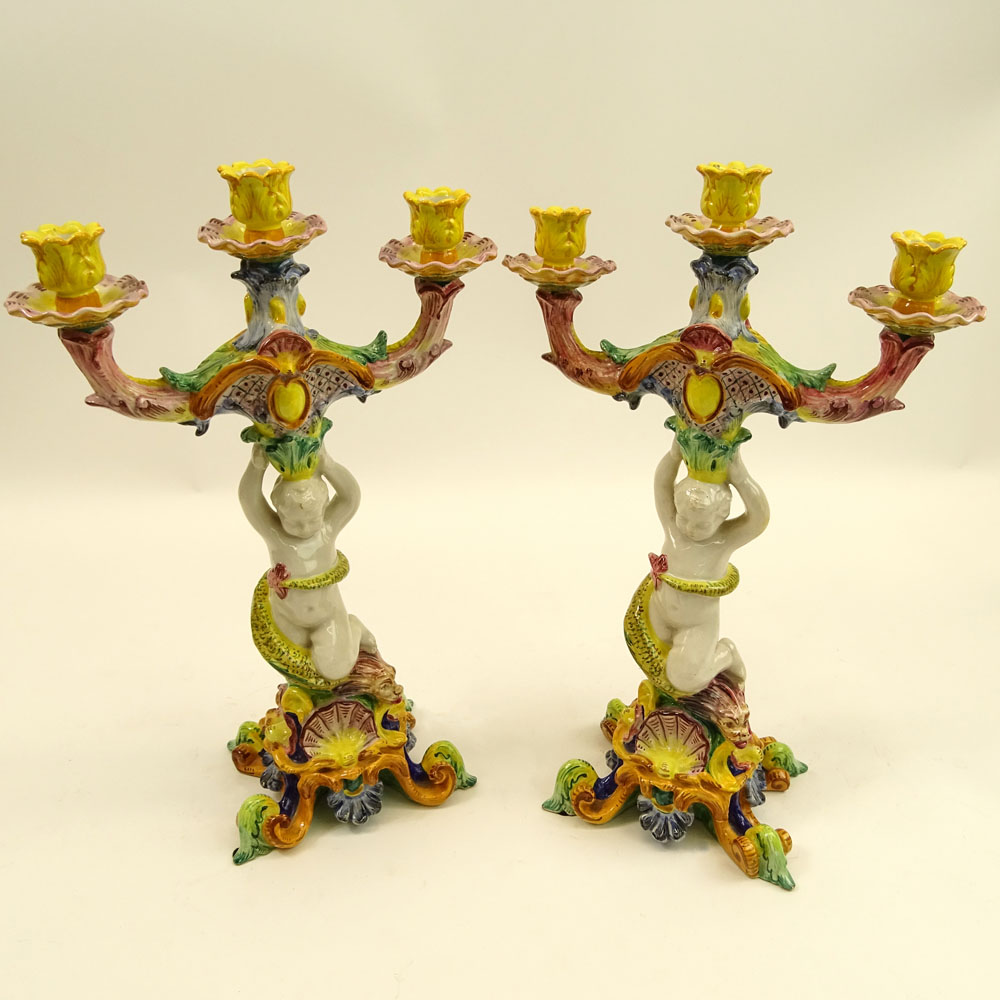 Pair of 20th Century Italian Majolica Figural Candlesticks. Each with 3 lights.