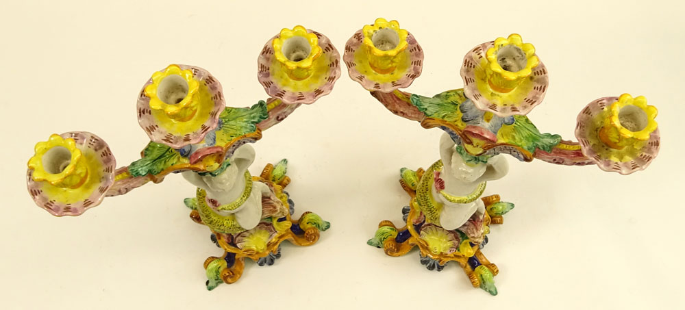 Pair of 20th Century Italian Majolica Figural Candlesticks. Each with 3 lights.