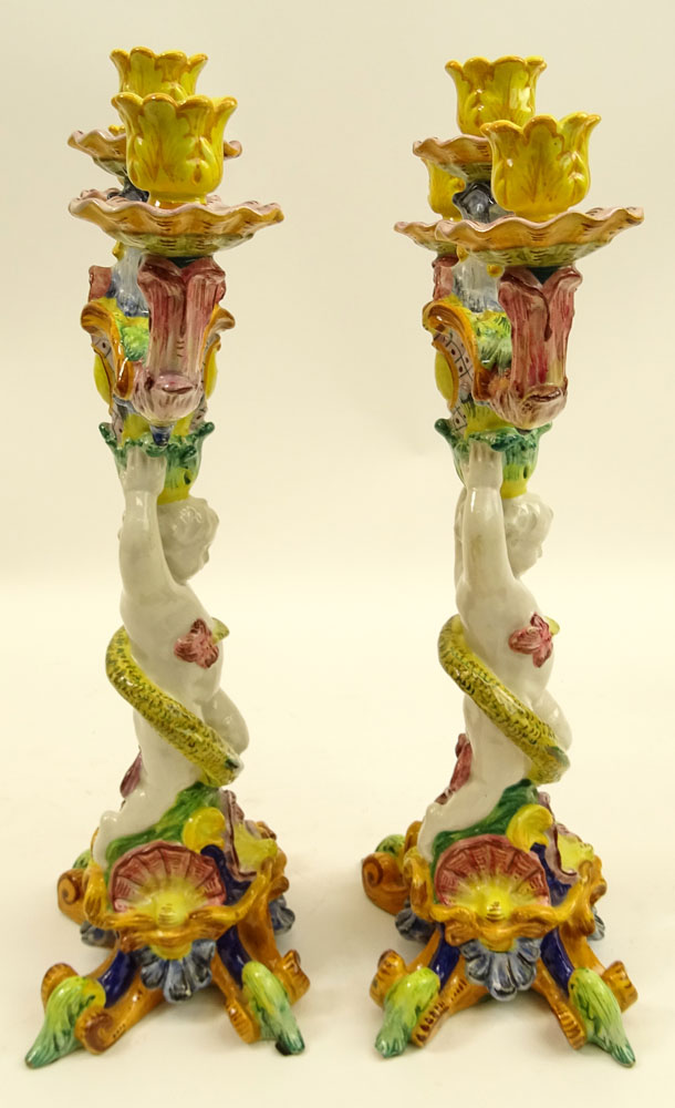 Pair of 20th Century Italian Majolica Figural Candlesticks. Each with 3 lights.