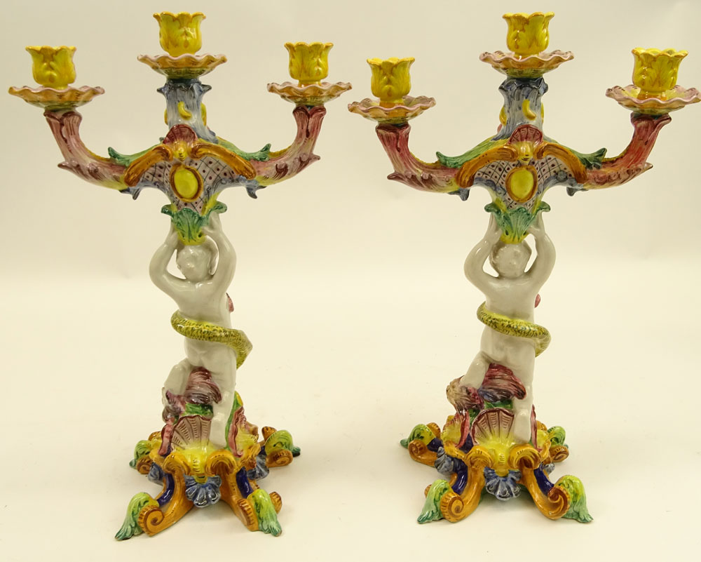 Pair of 20th Century Italian Majolica Figural Candlesticks. Each with 3 lights.