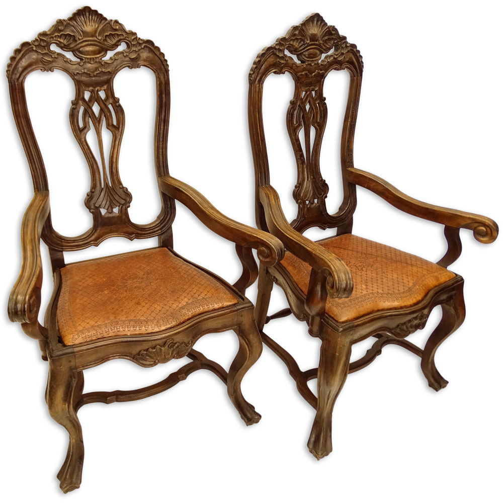 Pair of 20th Century Brazilian Portuguese Style Carved Wood and Tooled Leather Arm Chairs.