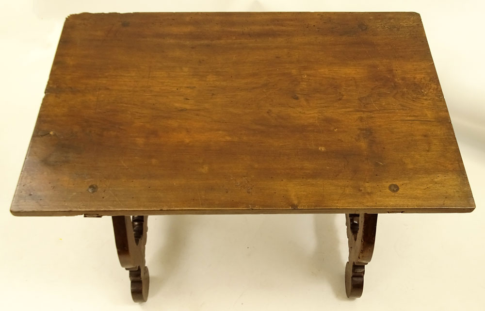 19th Century Italian Walnut Trestle Table. Comprised of a single plank on harp legs with iron stretchers.