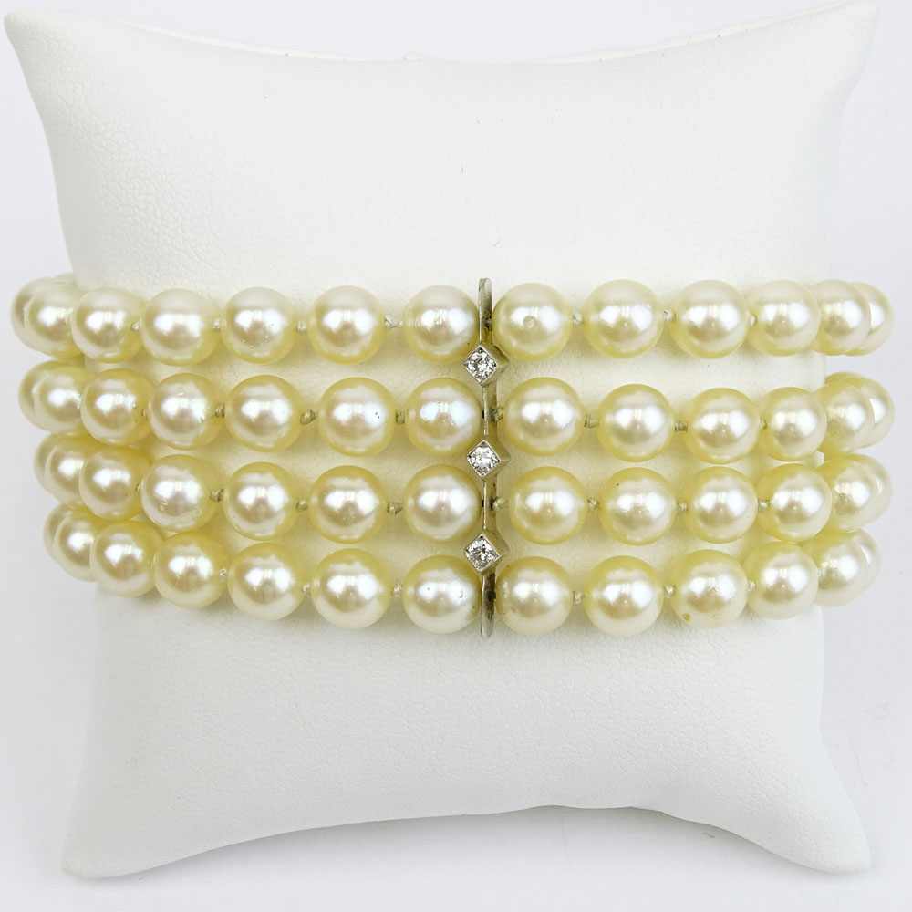 Vintage Four Strand Pearl, Diamond and 14 Karat White Gold Bracelet. 