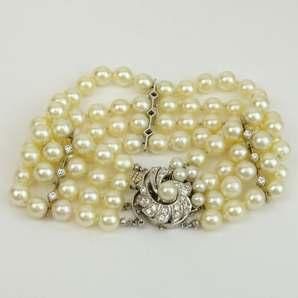 Vintage Four Strand Pearl, Diamond and 14 Karat White Gold Bracelet. 