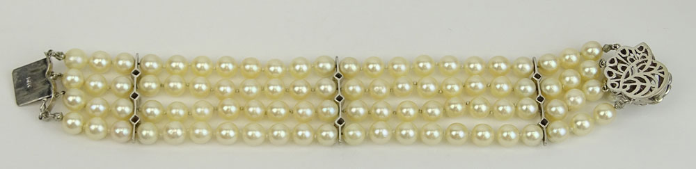 Vintage Four Strand Pearl, Diamond and 14 Karat White Gold Bracelet. 