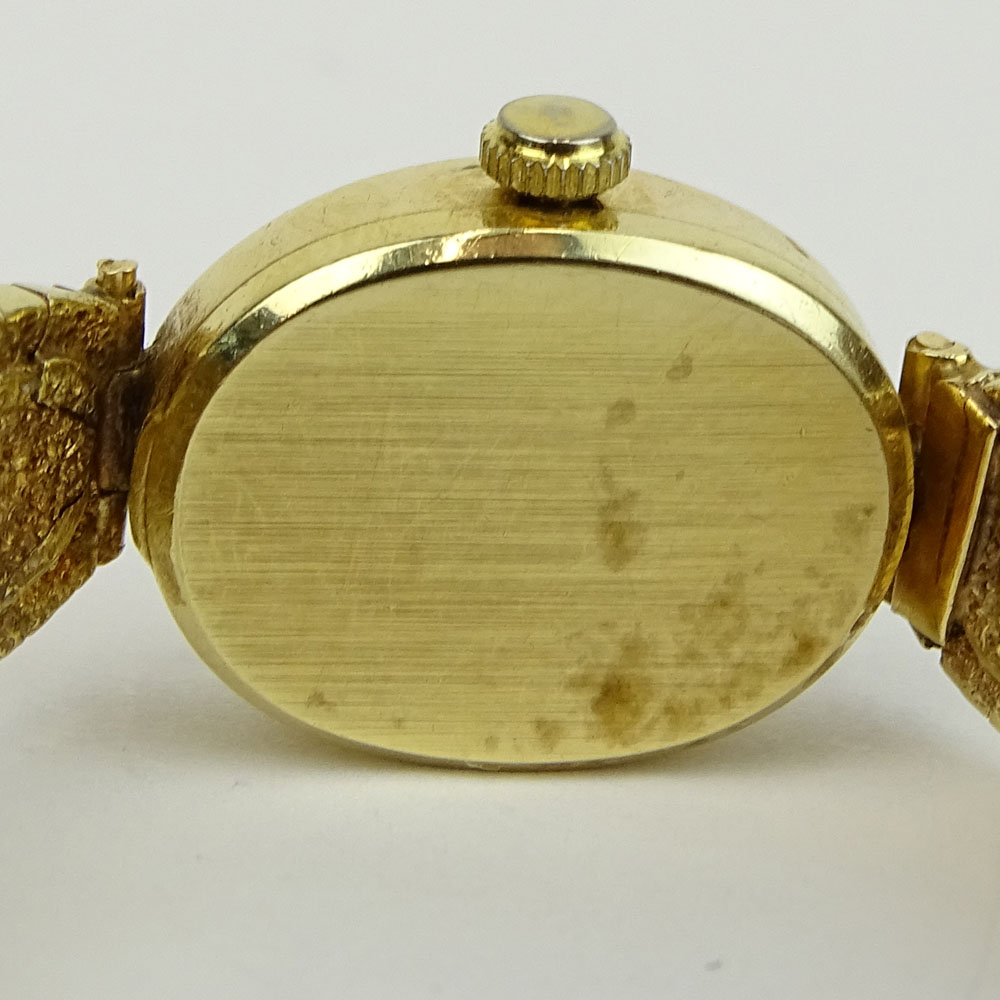 Lady's Vintage 14 Karat Yellow Gold Omega Bracelet Watch with Quartz Movement.