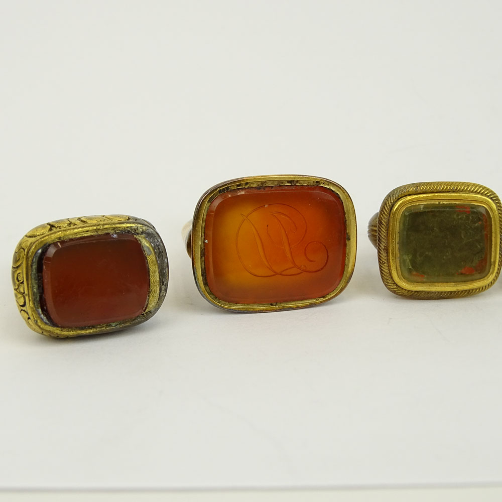 Collection of Seven (7) Antique Gold Filled Charms, Four with inset Carnelian