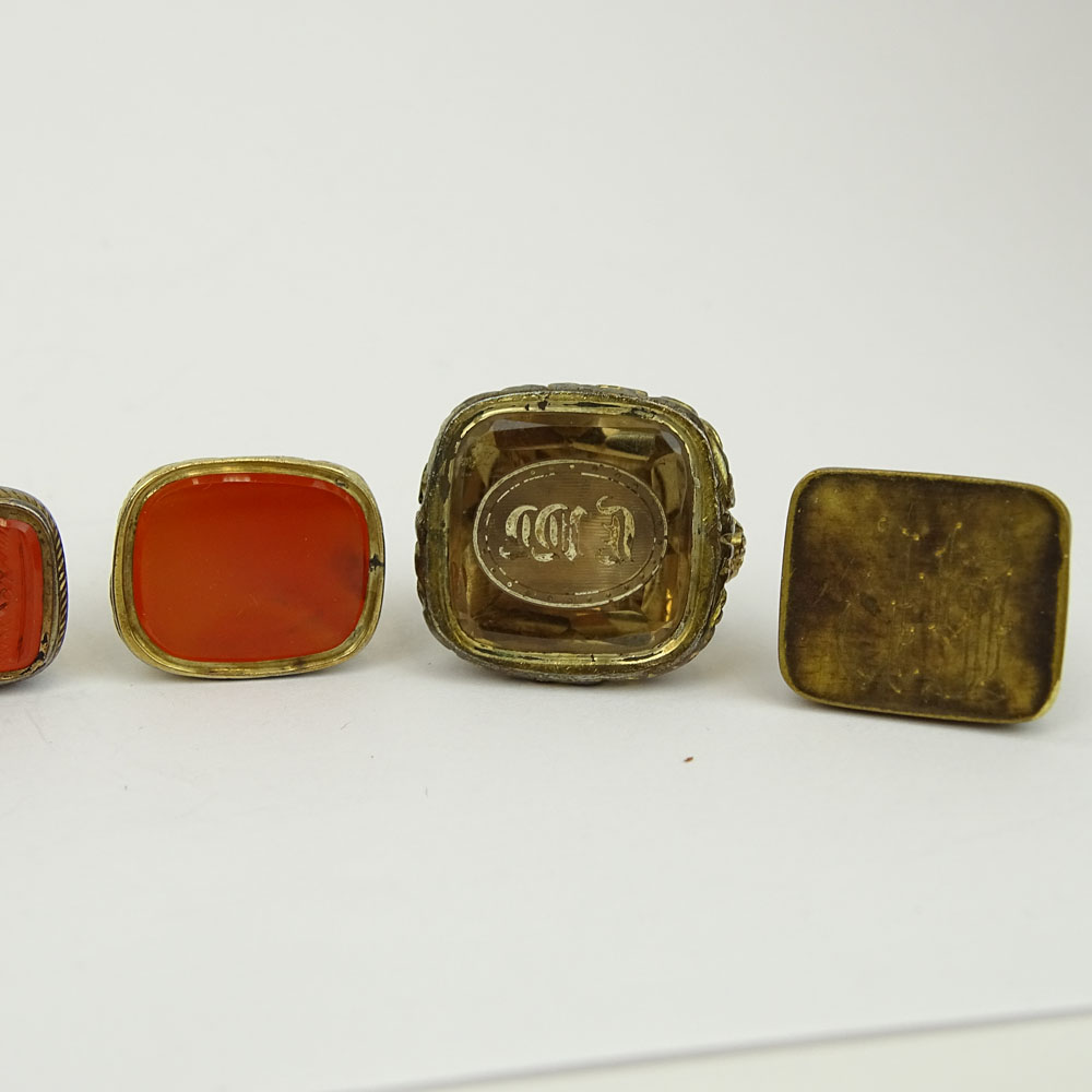 Collection of Seven (7) Antique Gold Filled Charms, Four with inset Carnelian