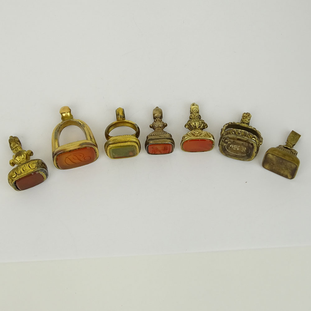 Collection of Seven (7) Antique Gold Filled Charms, Four with inset Carnelian