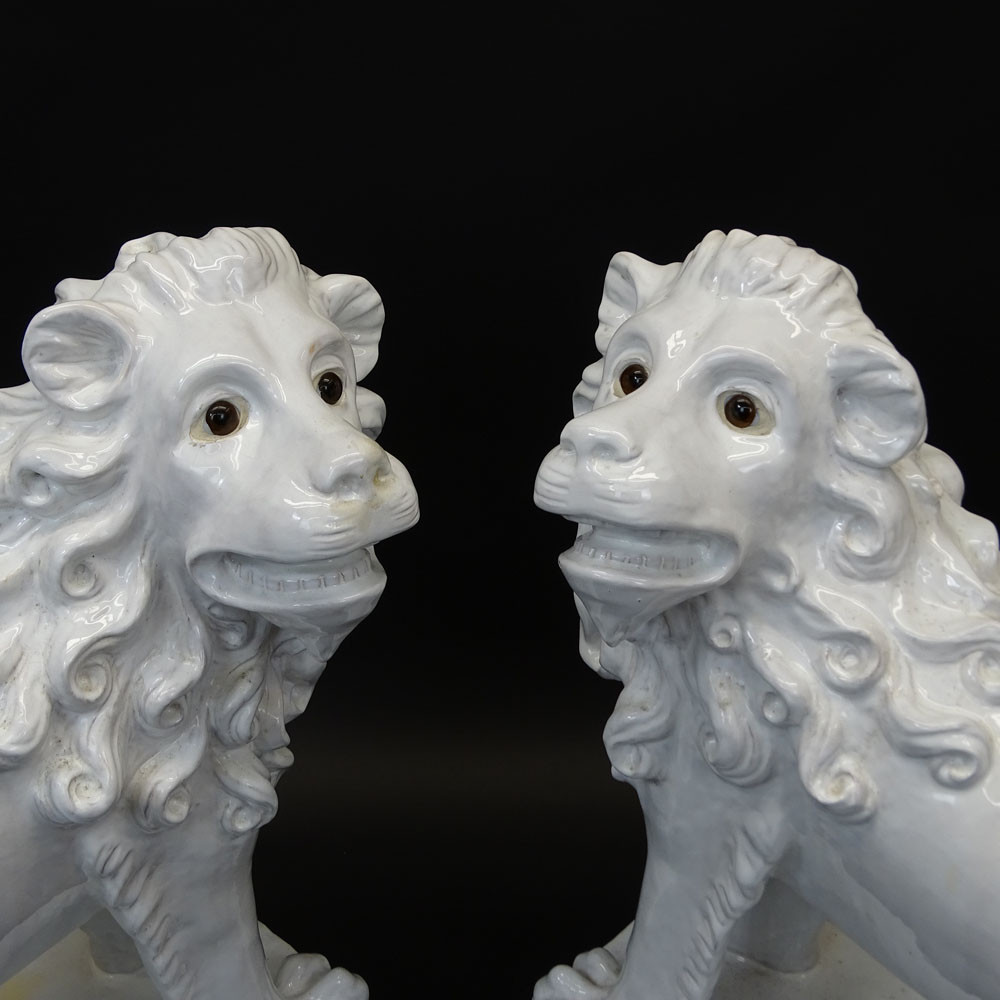 Pair of Large Vintage French White Glazed Faience Lions With Glass Eyes.