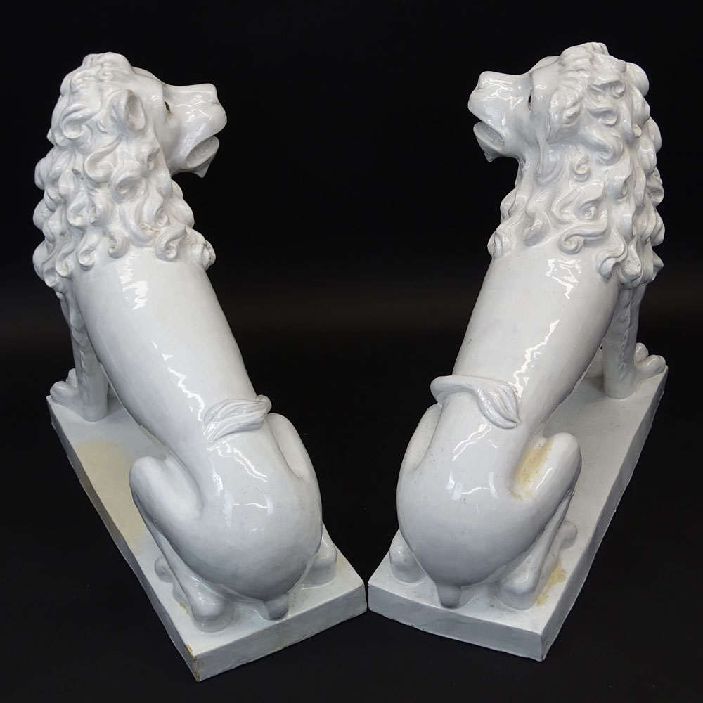 Pair of Large Vintage French White Glazed Faience Lions With Glass Eyes.