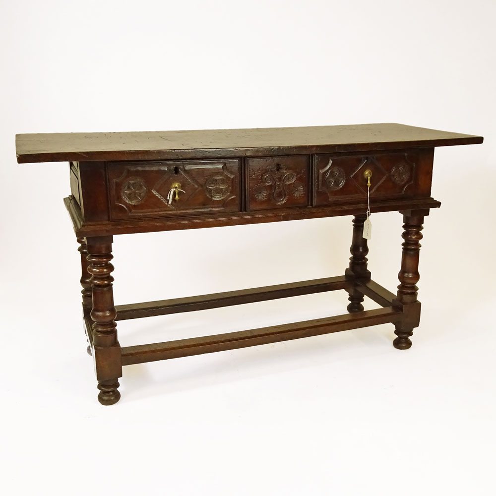 19th Century Continental Carved Oak Trestle Table With Three Drawers.