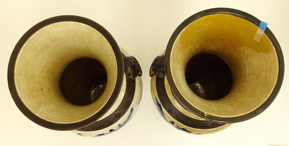 20th Century Chinese Guangxu style pottery vases with raised enamel foot, bands and mock figural ring handles. 