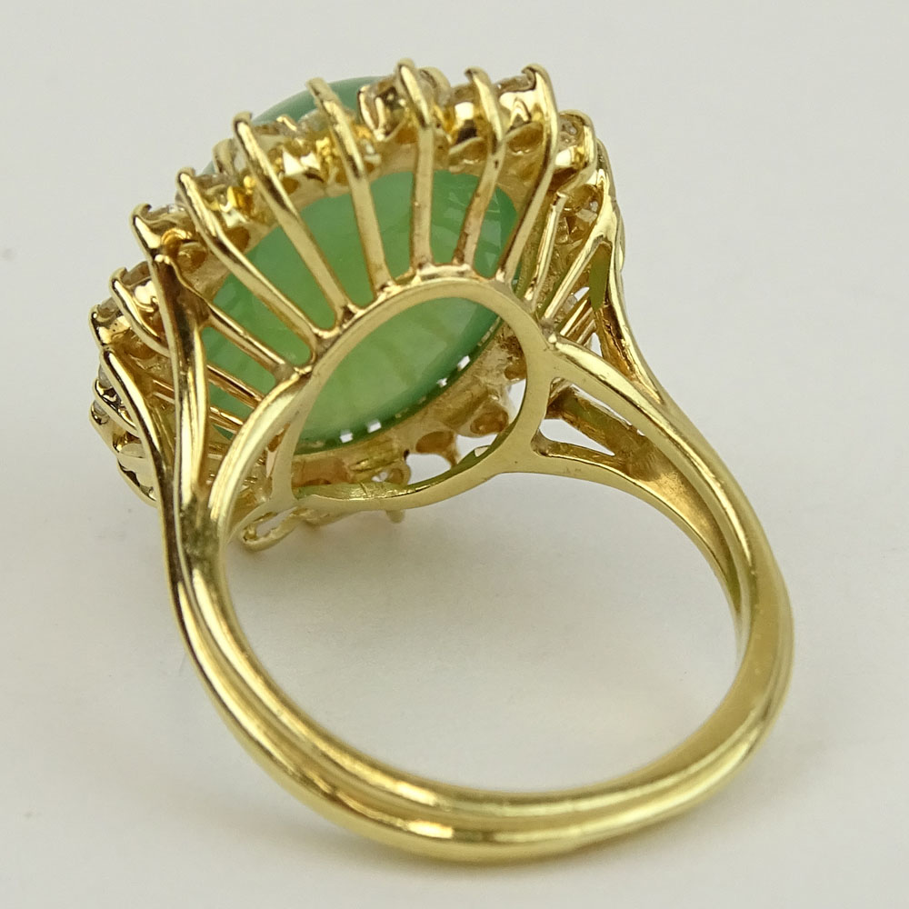 Vintage 14 Karat Yellow Gold Ring Set with Green Jade and Accented with Approx. 1.50 Carat Round Brilliant Cut Diamonds.