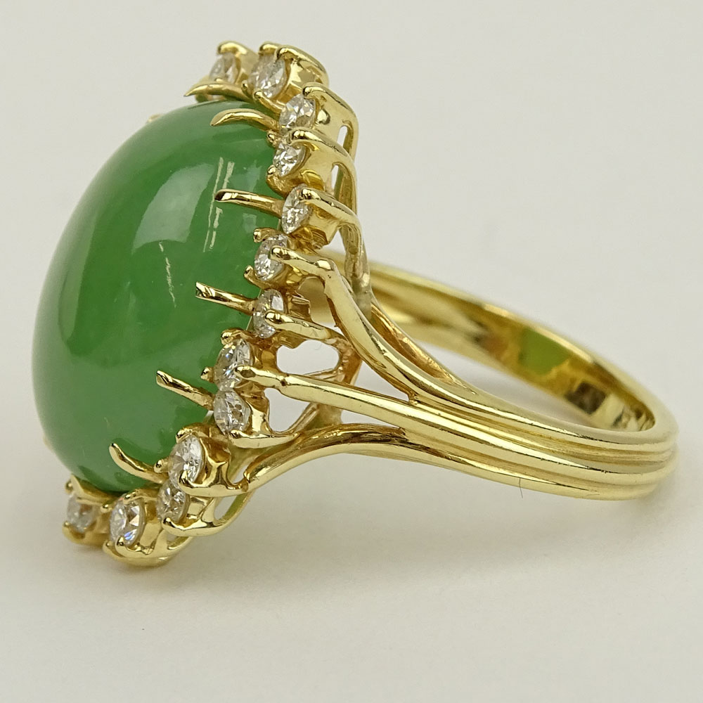 Vintage 14 Karat Yellow Gold Ring Set with Green Jade and Accented with Approx. 1.50 Carat Round Brilliant Cut Diamonds.