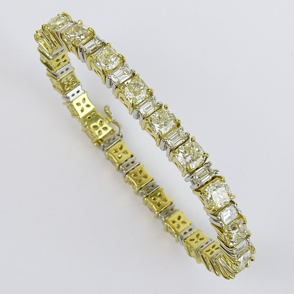 Stunning Diamond, Platinum and 18 Karat Yellow Gold Bracelet Set with Twenty-One (21) Cushion Cut Diamonds Approx. 21.25 Carats TW and Twenty-One (21) Emerald Cut Diamonds Approx. 6.0 Carats. 