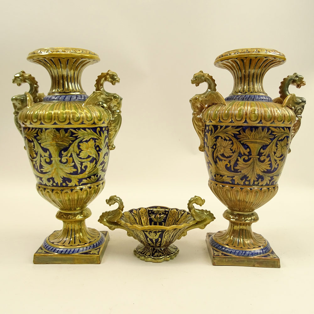 Three Pieces Early 20th Century Robbia Gualdo Tadino Painted Majolica Urns and compote. Chimera handles.