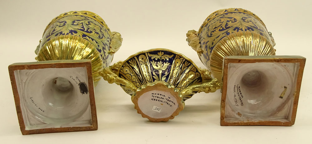 Three Pieces Early 20th Century Robbia Gualdo Tadino Painted Majolica Urns and compote. Chimera handles.