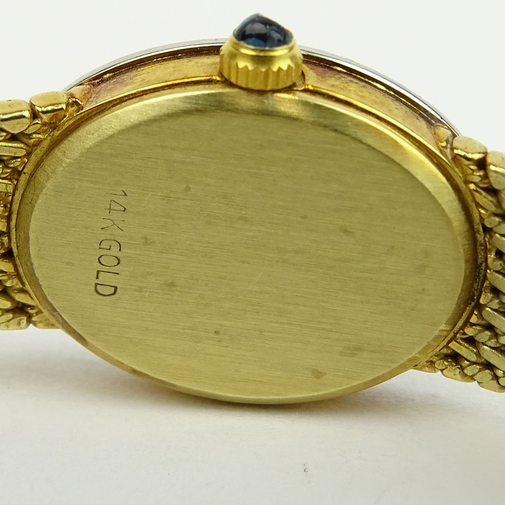 Lady's Black Starr & Frost 14 Karat Yellow Gold Bracelet Watch with Round Brilliant Cut Diamond Bezel. Quartz movement.