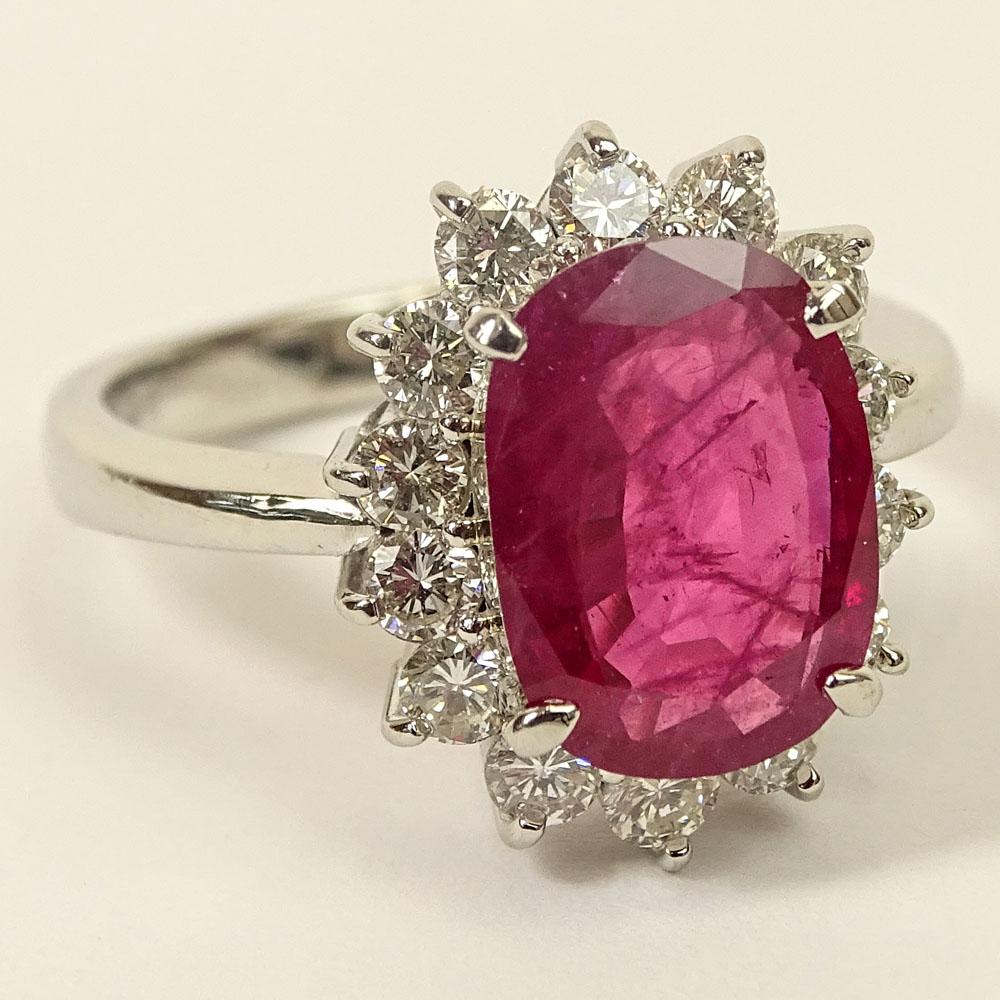 3.12 Carat Oval Cut Ruby, .94 Carat Round Brilliant Cut Diamond and Platinum Ring.