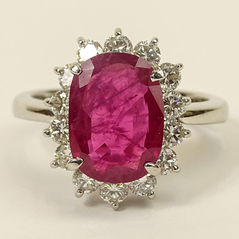 3.12 Carat Oval Cut Ruby, .94 Carat Round Brilliant Cut Diamond and Platinum Ring.