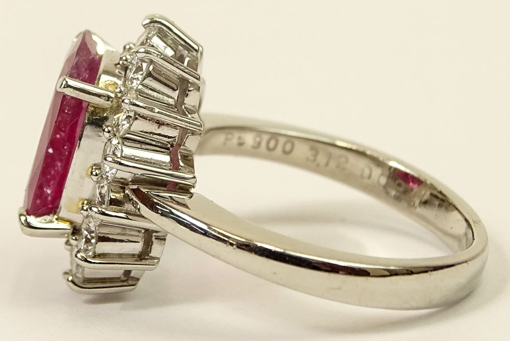 3.12 Carat Oval Cut Ruby, .94 Carat Round Brilliant Cut Diamond and Platinum Ring.