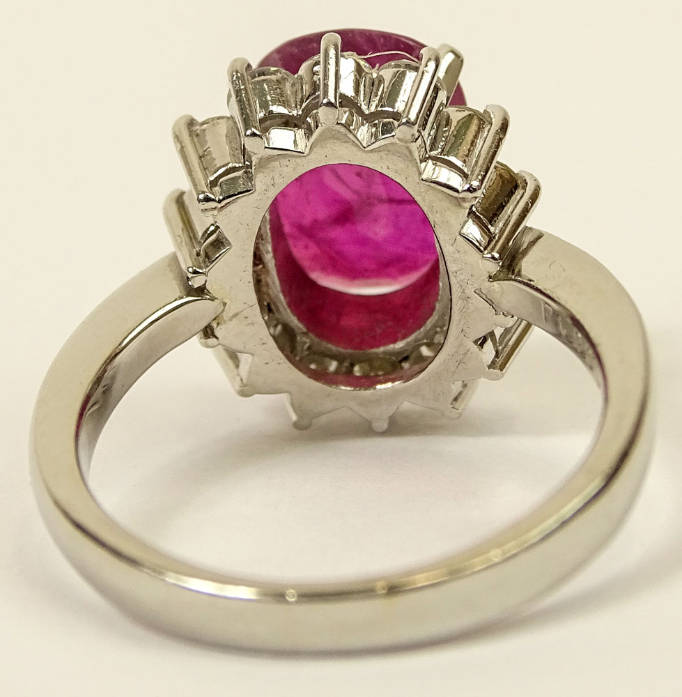 3.12 Carat Oval Cut Ruby, .94 Carat Round Brilliant Cut Diamond and Platinum Ring.