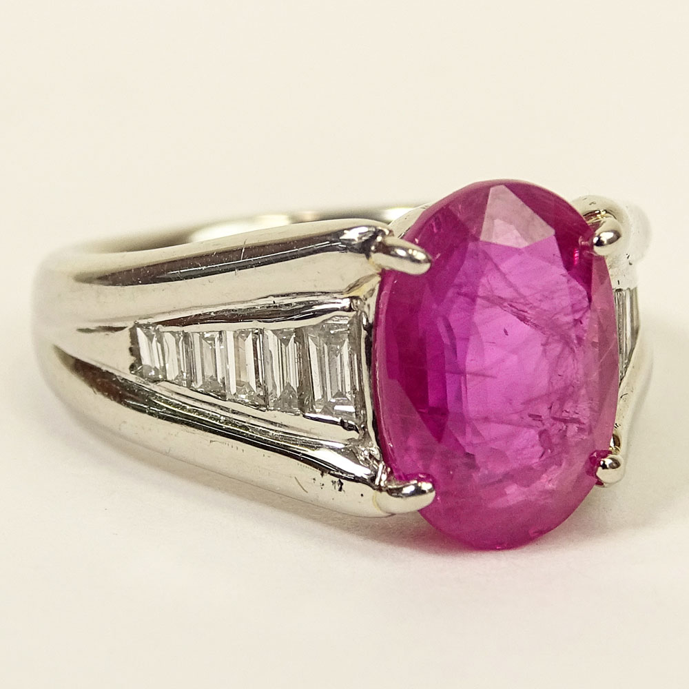 4.92 Carat Oval Cut Burma Ruby, .45 Carat Baguette Cut Diamond and Platinum Ring. 