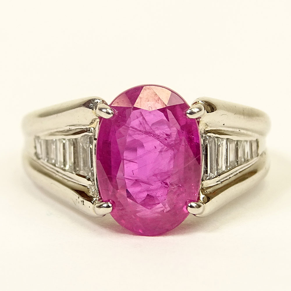 4.92 Carat Oval Cut Burma Ruby, .45 Carat Baguette Cut Diamond and Platinum Ring. 