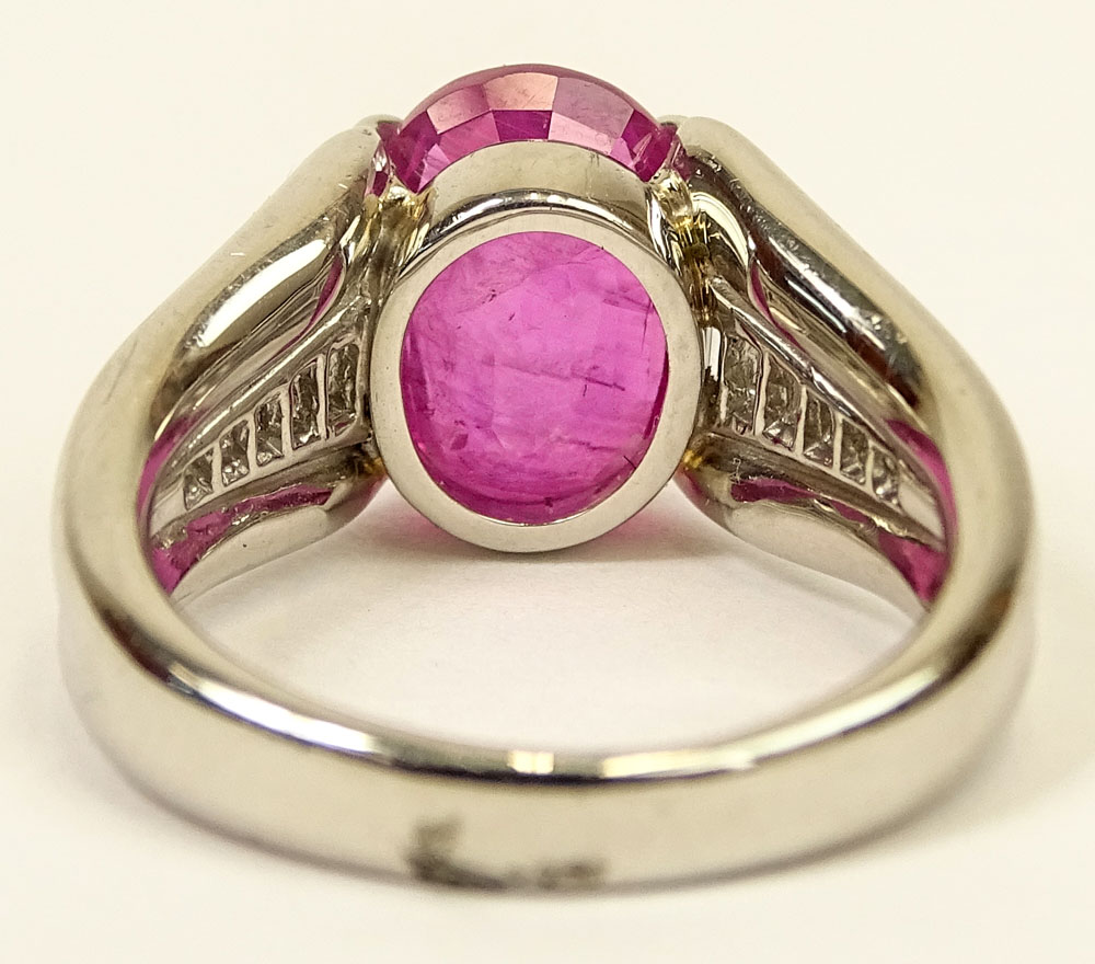 4.92 Carat Oval Cut Burma Ruby, .45 Carat Baguette Cut Diamond and Platinum Ring. 