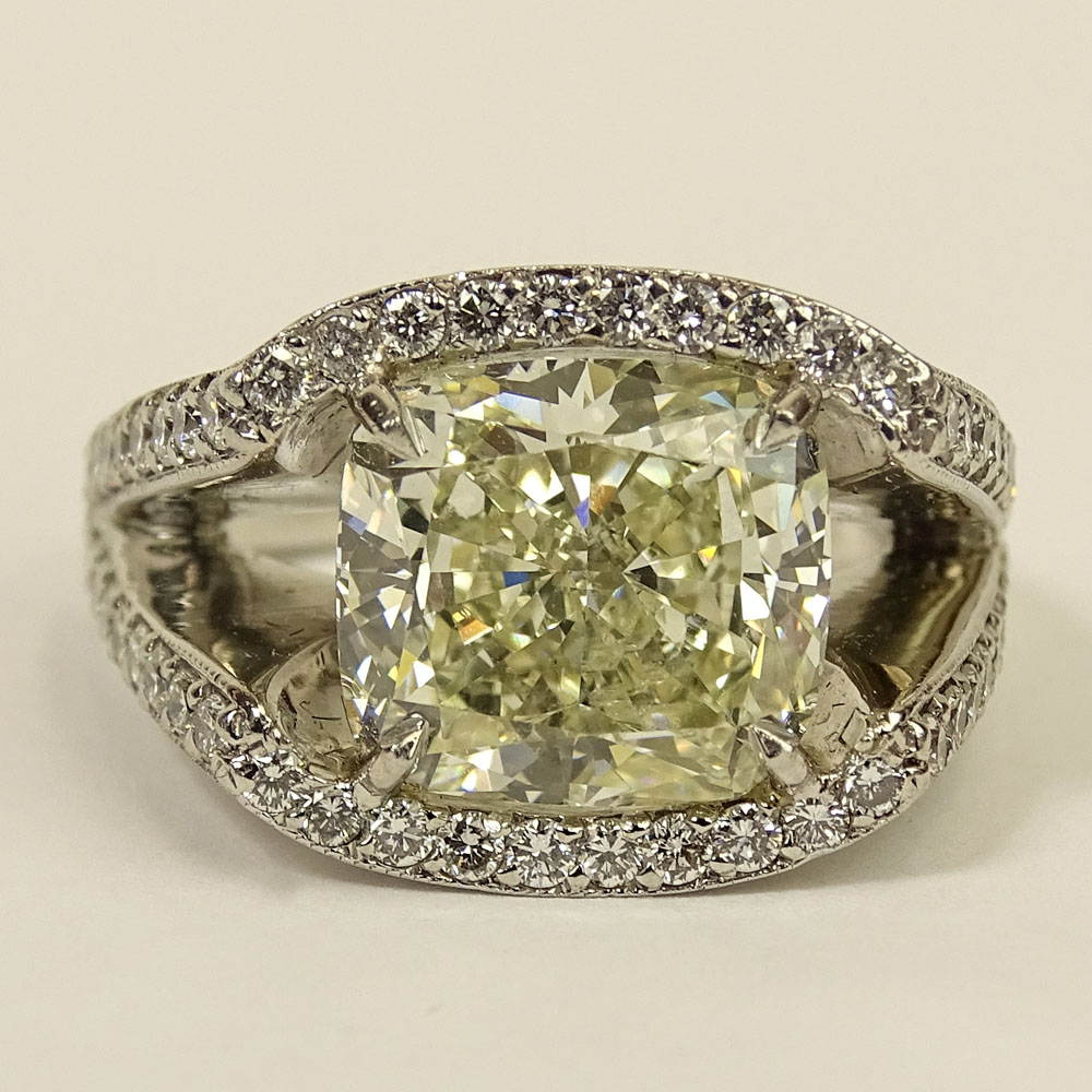 Important Approx. 7.01 Carat Cushion Cut Diamond and Platinum Ring accented with Micro Pave Set Diamonds Throughout.