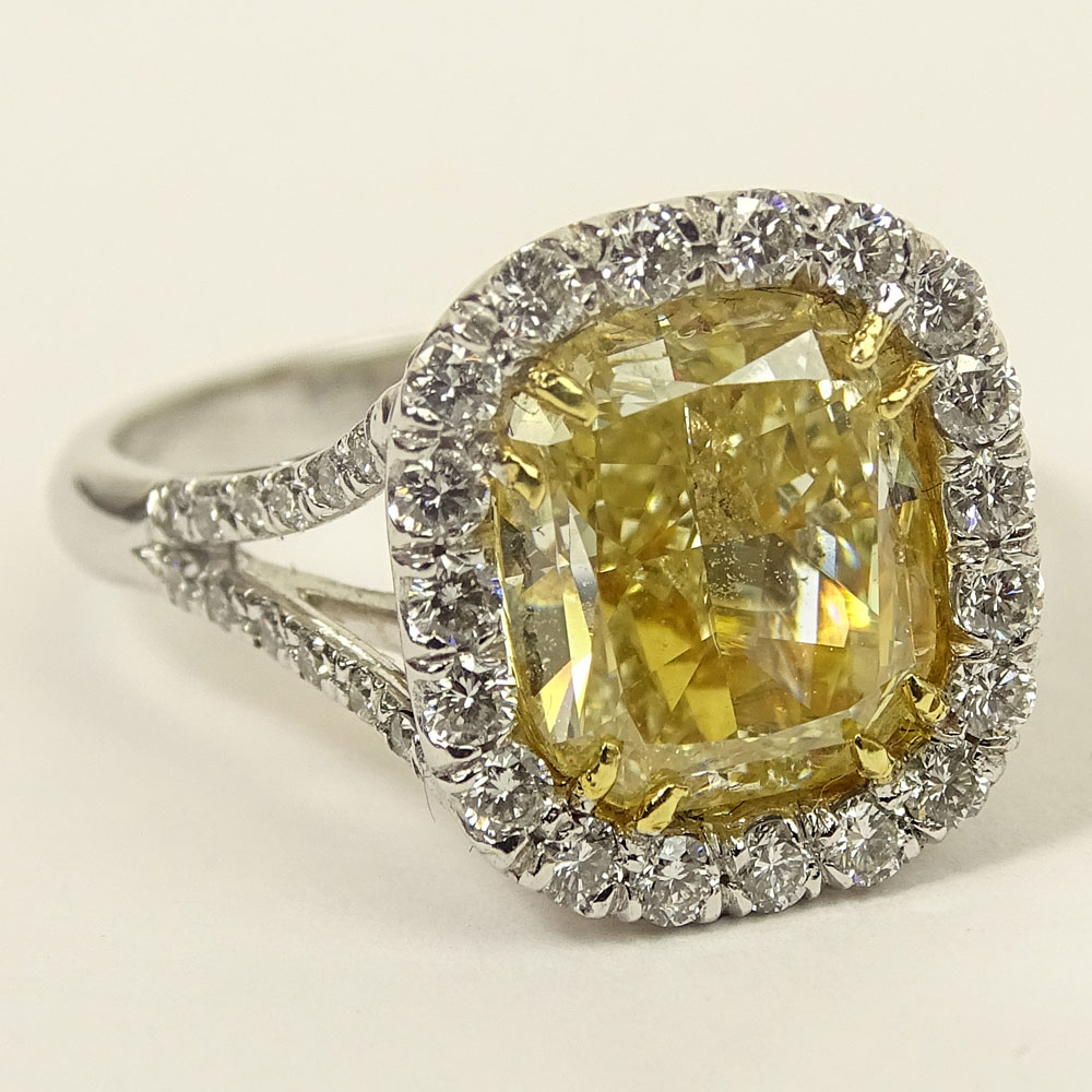 Important EGL Certified 5.22 Carat Cushion Cut Fancy Intense Yellow Diamond and 18 Karat White Gold Ring