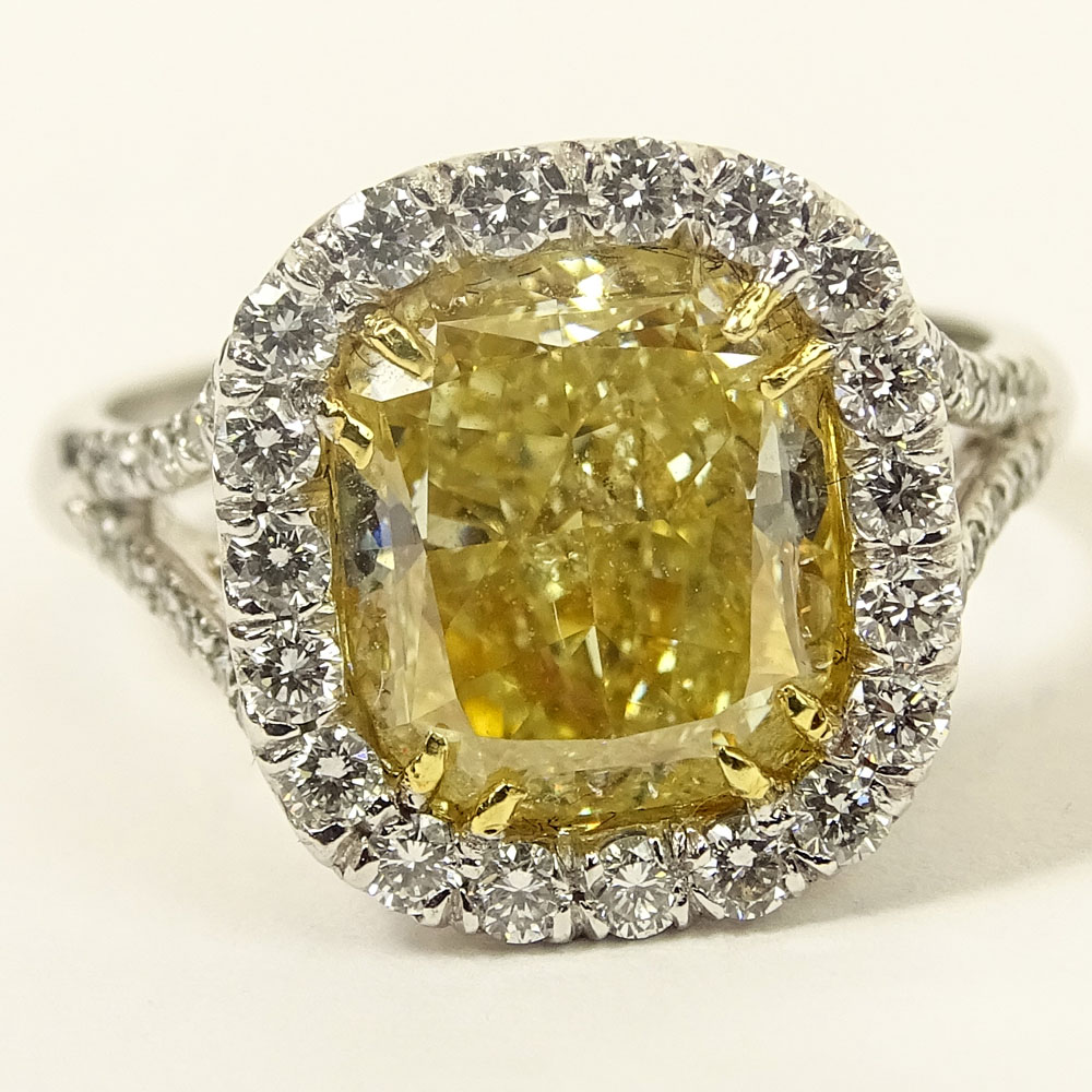 Important EGL Certified 5.22 Carat Cushion Cut Fancy Intense Yellow Diamond and 18 Karat White Gold Ring