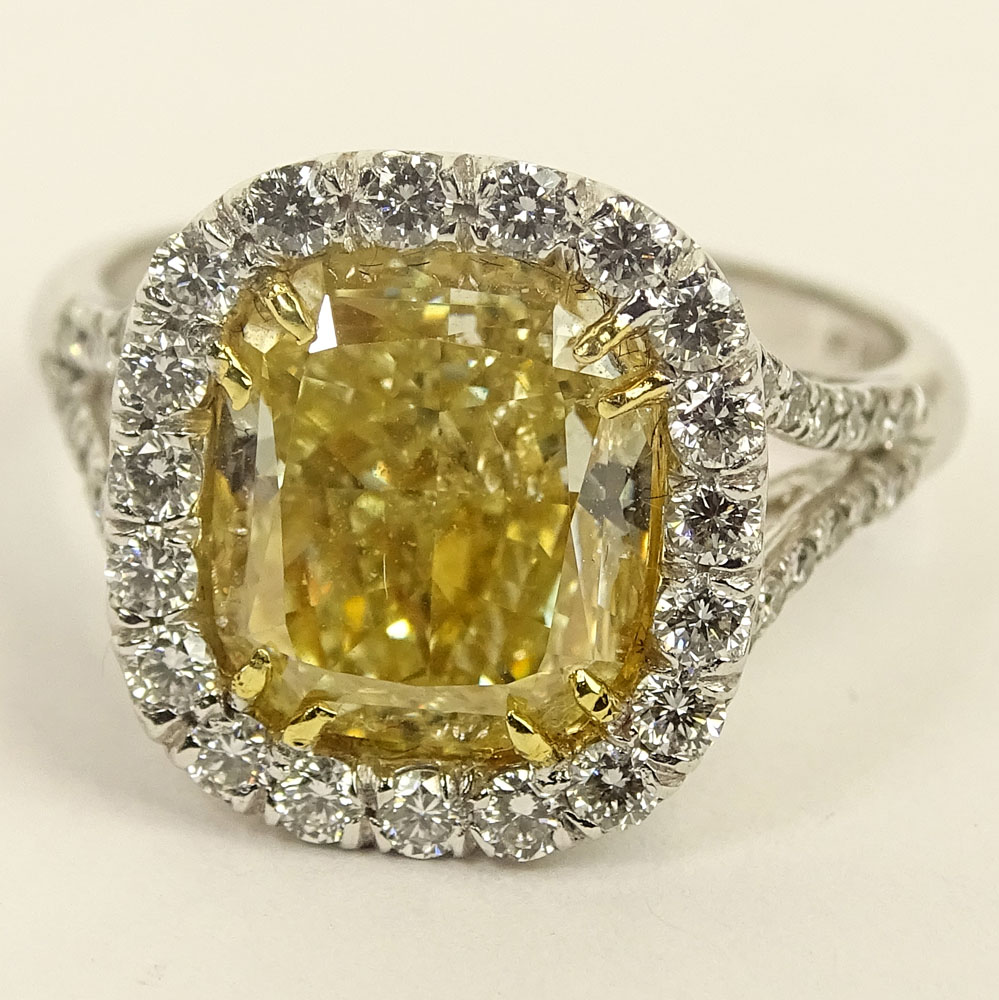 Important EGL Certified 5.22 Carat Cushion Cut Fancy Intense Yellow Diamond and 18 Karat White Gold Ring