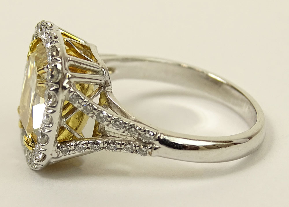 Important EGL Certified 5.22 Carat Cushion Cut Fancy Intense Yellow Diamond and 18 Karat White Gold Ring