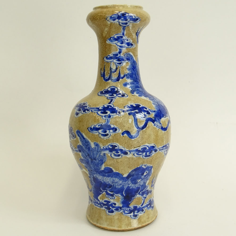 Antique Chinese Porcelain Baluster Vase with Blue and White Dragon and Clouds Motif.