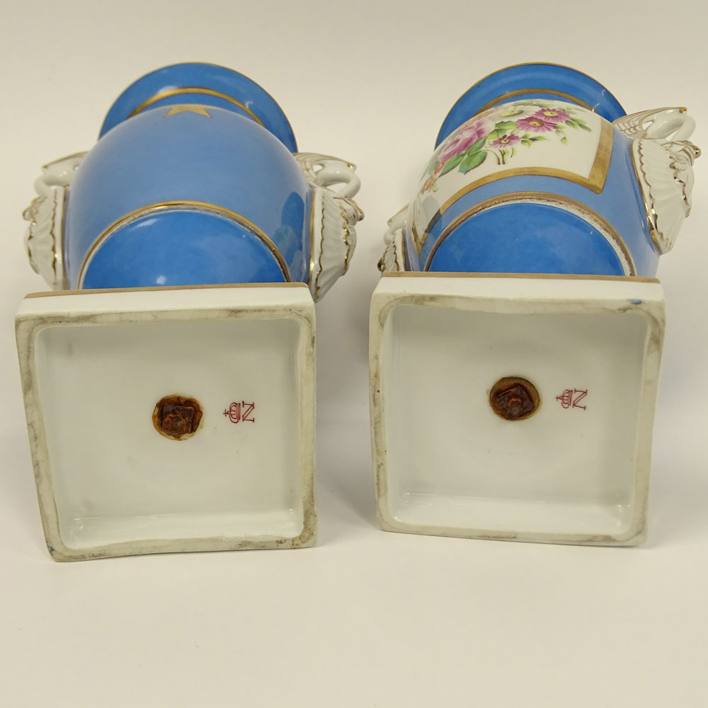 Pair of Antique Sevres Bleu Celeste Hand Painted Porcelain Bolted Urns With Swan Handles.