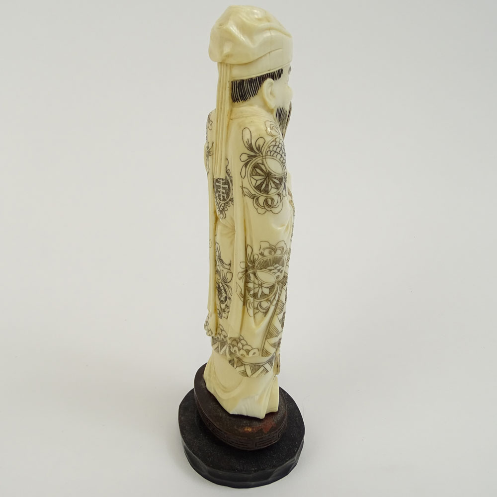 Vintage Carved Chinese Ivory Figure  on hardwood stand of a Man Holding a Ruyi.