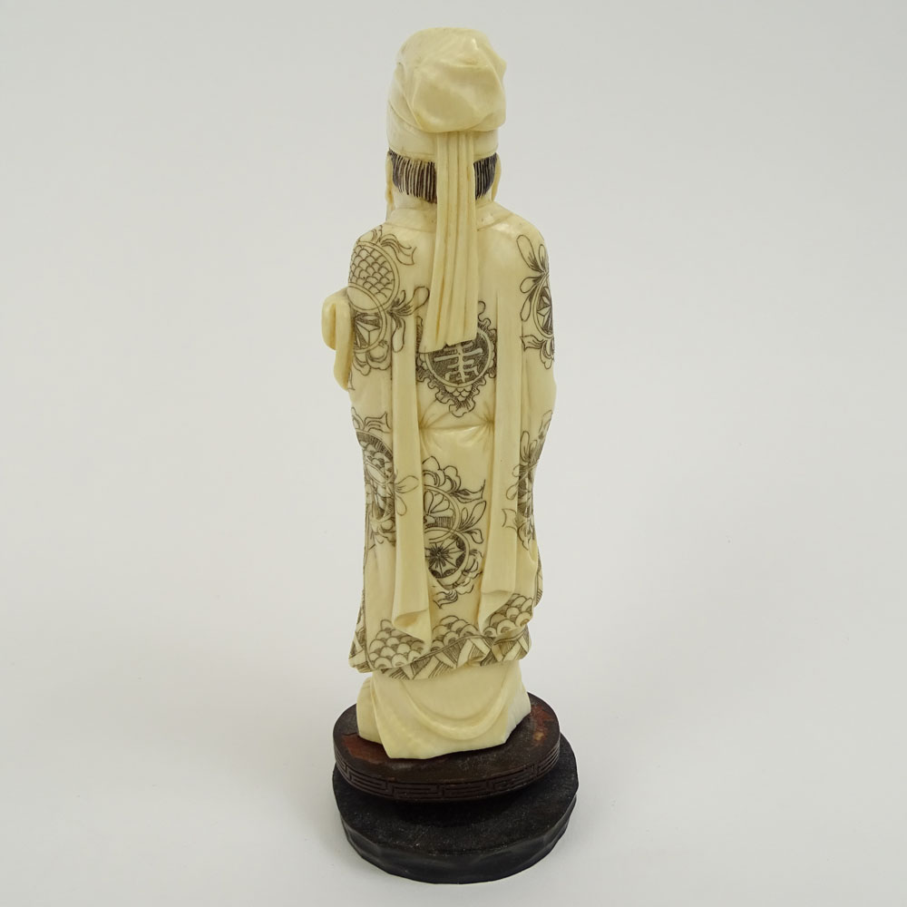 Vintage Carved Chinese Ivory Figure  on hardwood stand of a Man Holding a Ruyi.