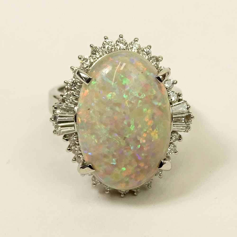 Lady's Approx. 8.31 Carat Oval Cut White Opal, .86 Carat Diamond and Platinum Ring. 