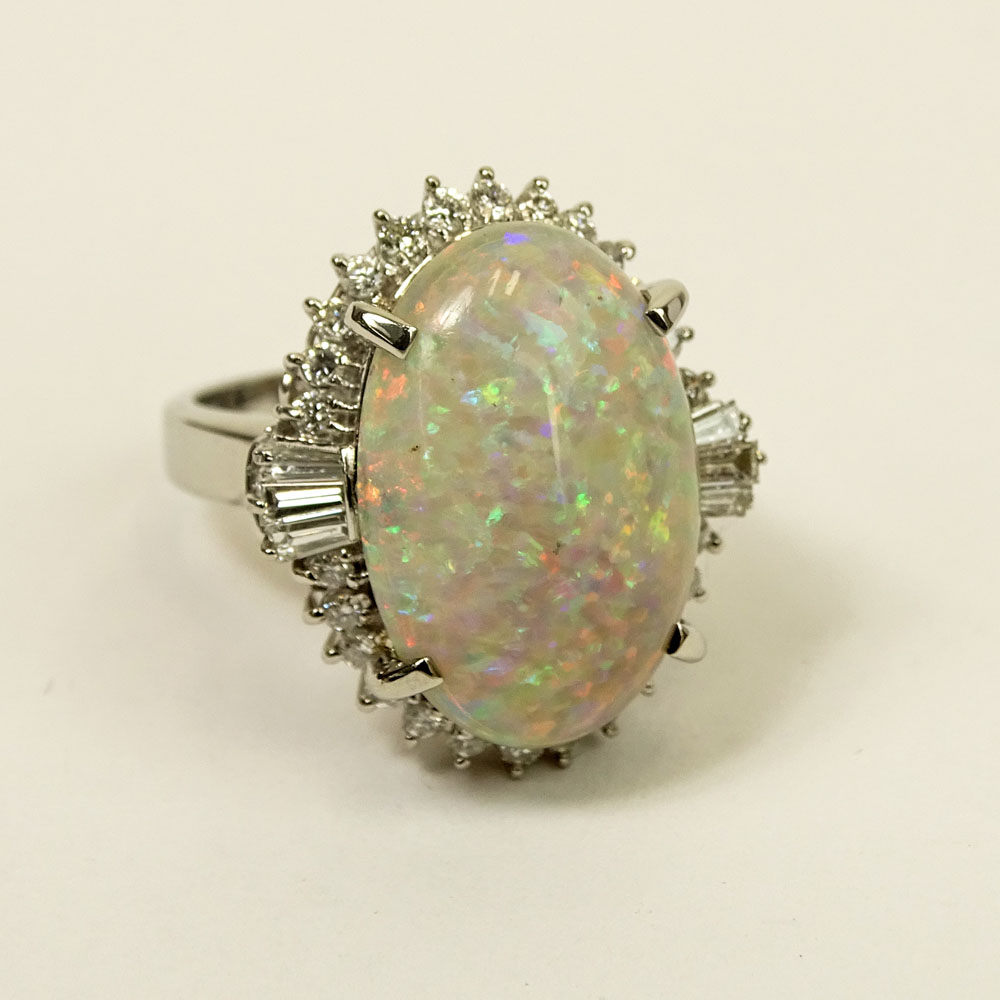 Lady's Approx. 8.31 Carat Oval Cut White Opal, .86 Carat Diamond and Platinum Ring. 