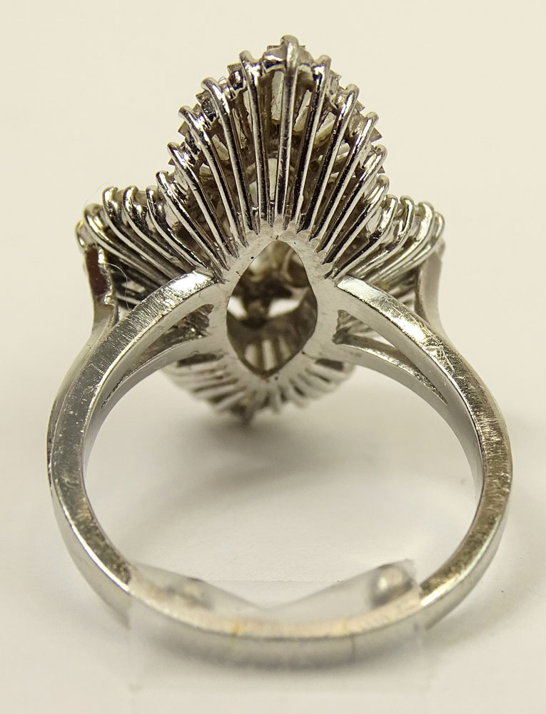 Vintage Approx. 6.0 Carat Total Weight Diamond and Platinum Ballerina Ring Set in the Center with a Marquise Diamond