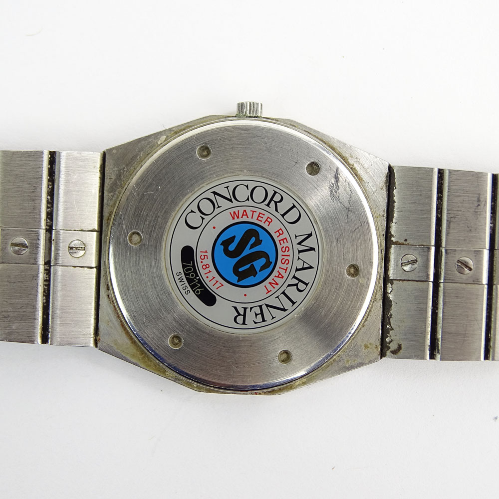 Men's Vintage Concord Stainless Steel and Gold Plate Bracelet Watch with Quartz Movement.