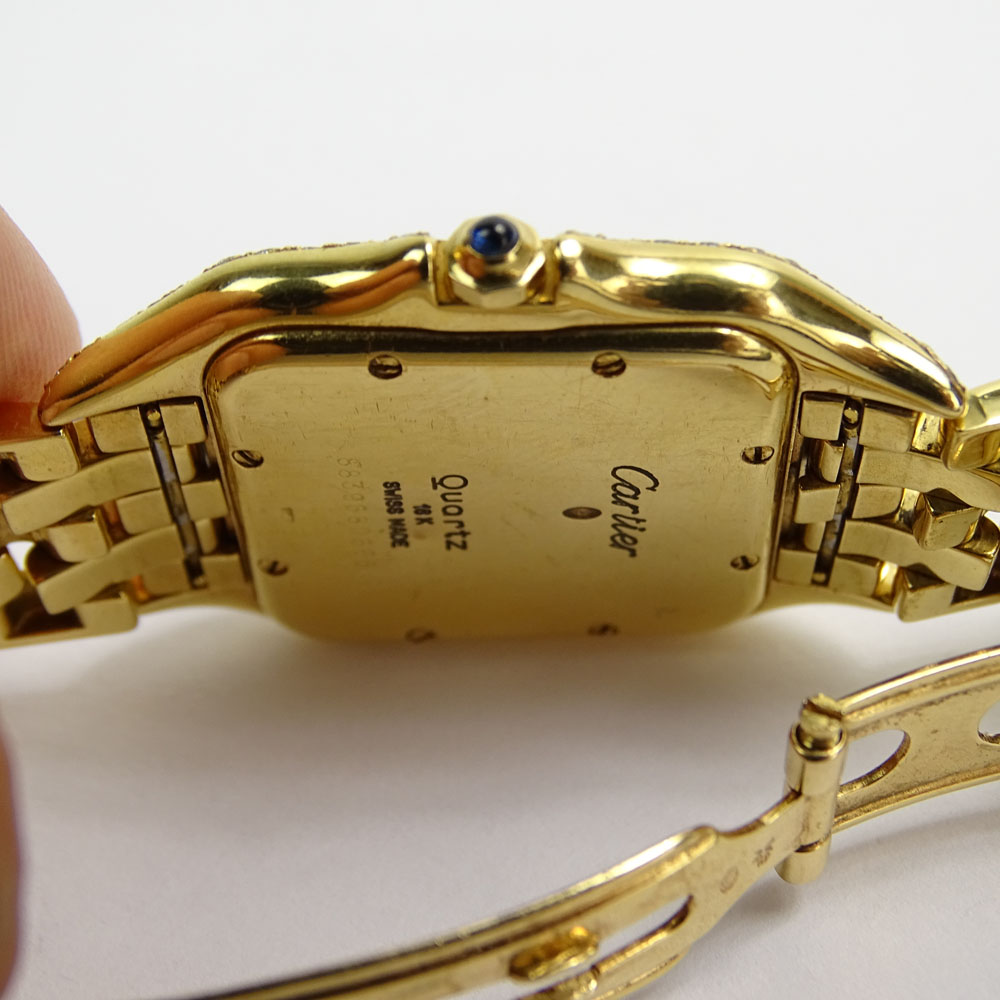 Lady's Cartier 18 Karat Yellow Gold Panther Watch with Diamond Bezel and Quartz Movement.