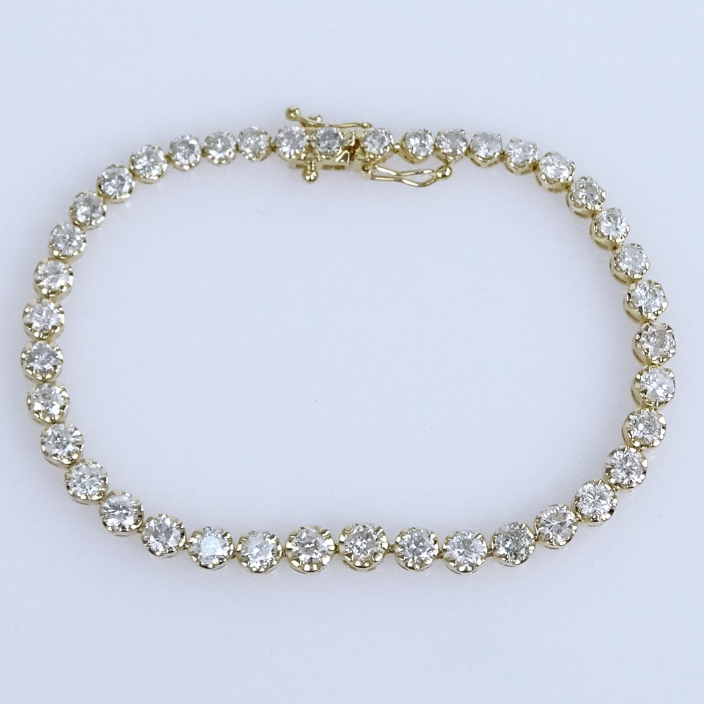 AIG Certified 6.56 Carat Round Brilliant Cut Diamond and 14 Karat Yellow Gold Tennis Bracelet.