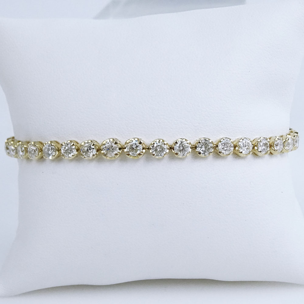 AIG Certified 6.56 Carat Round Brilliant Cut Diamond and 14 Karat Yellow Gold Tennis Bracelet.