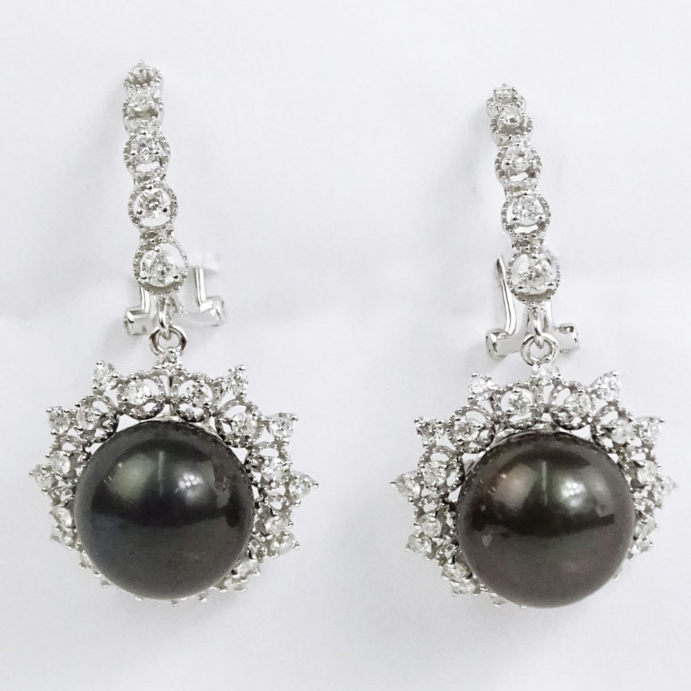 AIG Certified Tahitian Black Pearl, 1.60 Carat Round Brilliant Cut Diamond and 14 Karat White Gold Chandelier Earrings. 