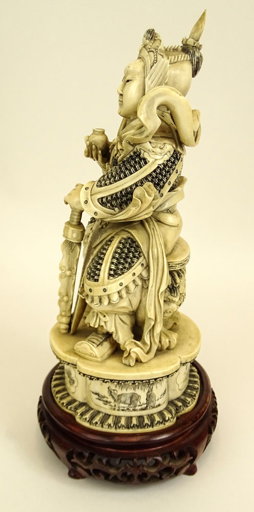 Heavy Chinese Carved Ivory Seated Warrior Figure on Carved Wood Base.