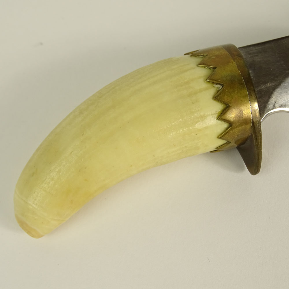 Three piece lot of ivory. Included a carved Ivory handled hunting knife in an eagle motif with tigers eye